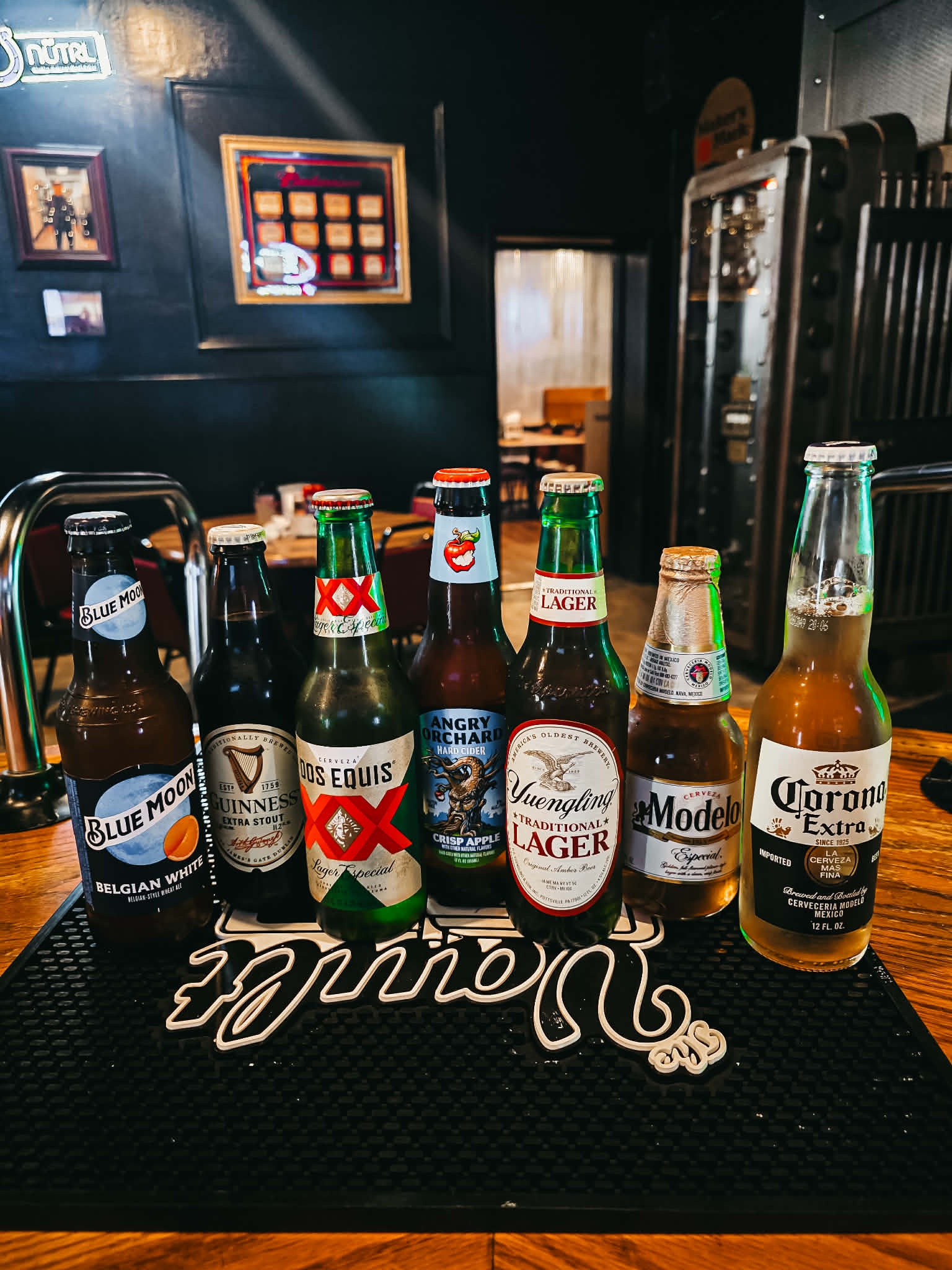 Import and craft beer selection — Blue Moon, Guinness, Dos Equis, Angry Orchard, Yuengling, Modelo, Corona Extra