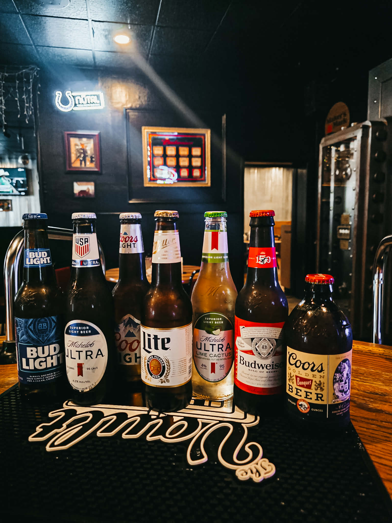 Domestic beer bottle lineup at The Vault